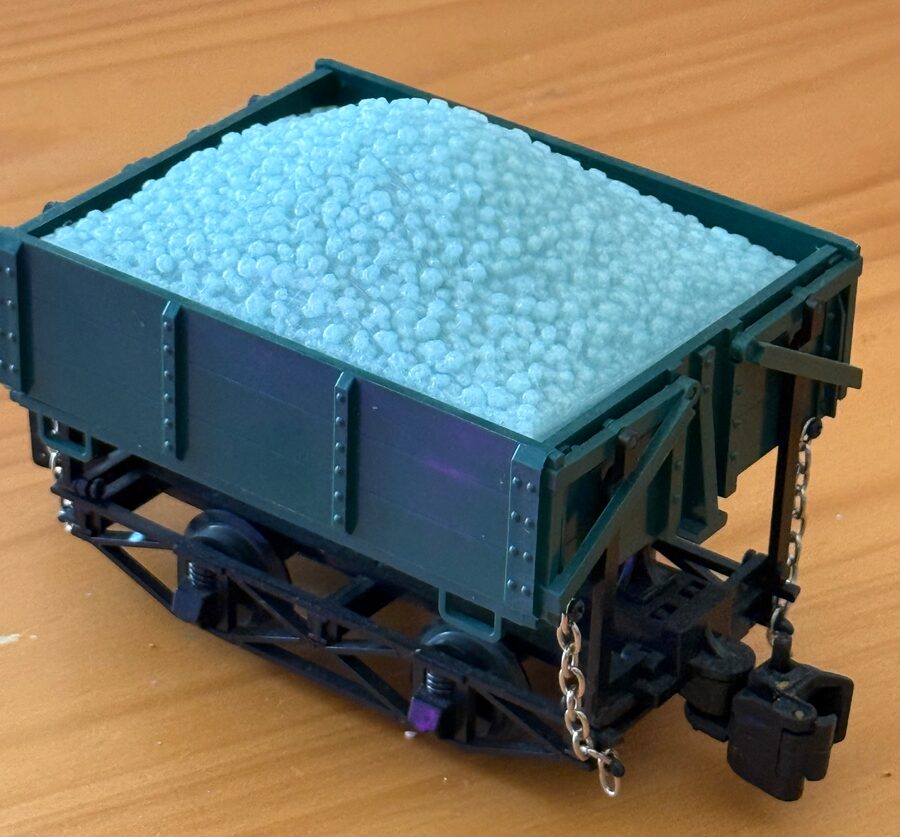3D-printed coal load in pale semi-translucent glow-in-the-dark filament, heaped in a green Bachmann G scale side dump ore car